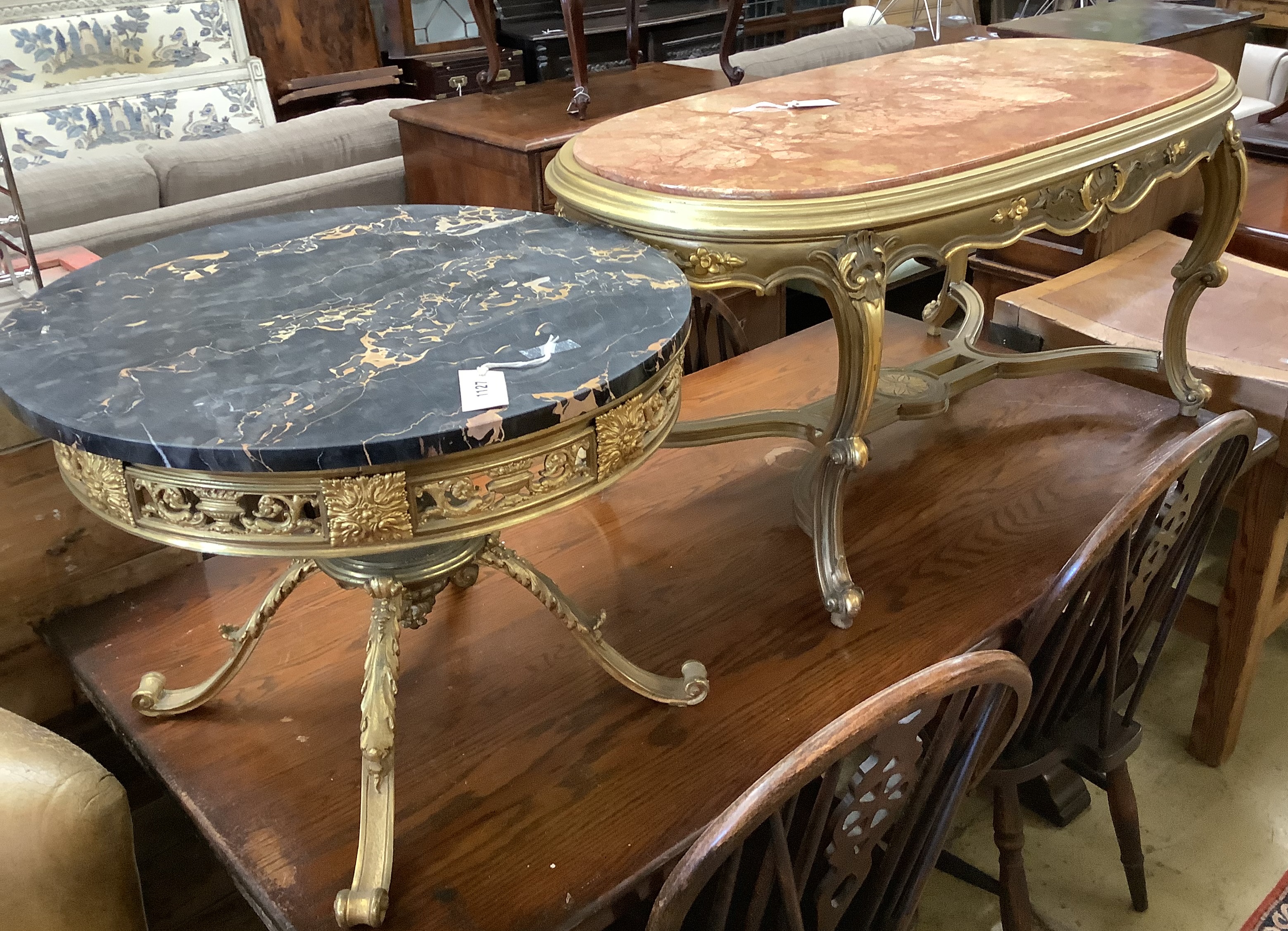 A circular gilt metal low coffee table with variegated marble top, diameter 62cm together with a larger faux marble coffee table